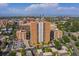 Aerial view of building with city skyline and mountain backdrop at 955 Eudora St # 203E, Denver, CO 80220