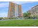 Well-maintained building exterior with landscaped grounds at 955 Eudora St # 203E, Denver, CO 80220