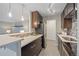 Well-equipped kitchen with stainless steel appliances and a breakfast bar at 955 Eudora St # 203E, Denver, CO 80220