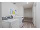 Clean laundry room with modern appliances and shelving at 955 Eudora St # 203E, Denver, CO 80220