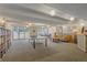 Bright recreation room with ping pong table, sofa, and library offers diverse entertainment options at 955 Eudora St # 203E, Denver, CO 80220