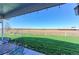 Expansive backyard with a large grassy area, patio seating, and open views at 11499 County Road 40 1/2 Rd, Platteville, CO 80651