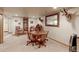 Finished basement featuring a rustic game table, decorative mirror, and display cabinet at 11499 County Road 40 1/2 Rd, Platteville, CO 80651