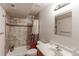Tiled bathroom featuring a shower, modern vanity, and neutral color scheme at 11499 County Road 40 1/2 Rd, Platteville, CO 80651