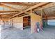 Interior view of horse stalls with metal gates and wood construction under a metal roof at 11499 County Road 40 1/2 Rd, Platteville, CO 80651