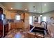 Spacious kitchen with wood cabinets, black appliances, and ample counter space at 11499 County Road 40 1/2 Rd, Platteville, CO 80651