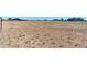 Acreage lot showing potential for multiple uses, with buildings in background on sunny day at 11499 County Road 40 1/2 Rd, Platteville, CO 80651