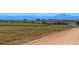 Scenic view of a wide-open property with vast land and distant mountain range at 11499 County Road 40 1/2 Rd, Platteville, CO 80651