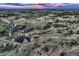 Expansive aerial view of the property with a serene pond and picturesque countryside at 10426 Tomahawk Rd, Parker, CO 80138