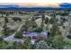 Charming home with mature trees on sprawling acreage, as seen from an aerial perspective at 10426 Tomahawk Rd, Parker, CO 80138