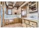 Bathroom features wood cabinets, soaking tub and wood beams in a home, creating a spa-like retreat at 10426 Tomahawk Rd, Parker, CO 80138