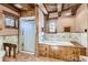 Rustic bathroom featuring a shower, soaking tub, and wood accents at 10426 Tomahawk Rd, Parker, CO 80138