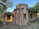 Unique two-story home featuring southwestern style architecture and a rustic wooden ladder accent at 10426 Tomahawk Rd, Parker, CO 80138