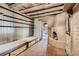 Intimate living area features exposed beam ceiling and fireplace at 10426 Tomahawk Rd, Parker, CO 80138