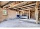 Cozy living room features wood beamed ceilings, brick walls, and ample natural light at 10426 Tomahawk Rd, Parker, CO 80138