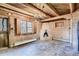 Adobe living room showcases brick floors and fireplace in a home, creating a cozy retreat at 10426 Tomahawk Rd, Parker, CO 80138