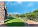 A spacious backyard features a manicured lawn, river rock accents, mature trees and professional landscaping at 4515 W 107Th Cir, Westminster, CO 80031