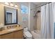 Well-lit bathroom with shower-tub combo, modern fixtures, and vanity with granite countertop at 4515 W 107Th Cir, Westminster, CO 80031