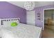 Cozy bedroom features a white bed with soft pillows and a decorative chandelier at 4515 W 107Th Cir, Westminster, CO 80031