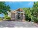A stone clubhouse features a ramp and staircase leading to a glass-paned door and well-lit entry way at 4515 W 107Th Cir, Westminster, CO 80031