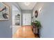 Bright entryway features hardwood floors and stylish accents, creating a warm welcome at 4515 W 107Th Cir, Westminster, CO 80031