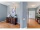 Entryway with hardwood floors, an ornate sideboard and artwork on the wall at 4515 W 107Th Cir, Westminster, CO 80031