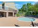 A community hot tub sits next to mature landscaping and a stone bath house with covered patio at 4515 W 107Th Cir, Westminster, CO 80031