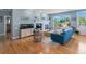 Comfortable living room showcasing a fireplace, hardwood floors, and bright natural light at 4515 W 107Th Cir, Westminster, CO 80031