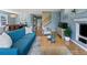 Spacious living room with hardwood floors, a fireplace, and an open view to the dining area at 4515 W 107Th Cir, Westminster, CO 80031
