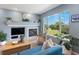 Charming living room featuring a fireplace and a large window with picturesque views at 4515 W 107Th Cir, Westminster, CO 80031