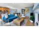 Open-concept living room with hardwood floors, a fireplace, and a view of the staircase at 4515 W 107Th Cir, Westminster, CO 80031
