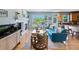 Cozy living room with a fireplace, large windows, and comfortable seating at 4515 W 107Th Cir, Westminster, CO 80031