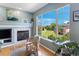 Inviting living room showcasing a cozy fireplace and serene outdoor views at 4515 W 107Th Cir, Westminster, CO 80031