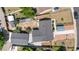 Birds eye view of a home with detached garage, with basketball court, covered parking, and greenhouse at 935 S Pecos Way, Denver, CO 80223