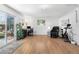 Open living space features hardwood floors, a home office area, and comfortable seating at 935 S Pecos Way, Denver, CO 80223