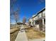 A row of townhouses on a sunny day at 15612 E 96Th Way # 13E, Commerce City, CO 80022