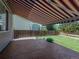 Backyard featuring a well-maintained lawn, wooden fence, and stamped concrete patio at 5369 Creek Way, Parker, CO 80134