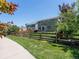 Backyard featuring a well-maintained lawn, wooden fence and mature trees at 5369 Creek Way, Parker, CO 80134
