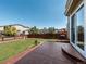 Backyard featuring a well-maintained lawn, wooden fence, and stamped concrete patio at 5369 Creek Way, Parker, CO 80134