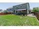 Backyard featuring a well-maintained lawn and a covered patio at 5369 Creek Way, Parker, CO 80134