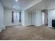 Spacious finished basement with carpeting, white walls, a window for natural light, and closet storage at 5369 Creek Way, Parker, CO 80134