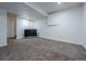 Finished basement area with neutral carpeting, white walls, and an entertainment setup for a cozy space at 5369 Creek Way, Parker, CO 80134