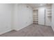 Neutral bedroom featuring a built-in closet and shelving for ample storage at 5369 Creek Way, Parker, CO 80134