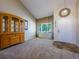 Inviting foyer features a soaring ceiling, wooden cabinet, and bright window that create a warm, welcoming entrance at 5369 Creek Way, Parker, CO 80134
