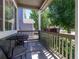 Charming front porch featuring a cozy seating area and vibrant flower boxes, perfect for relaxing outdoors at 5369 Creek Way, Parker, CO 80134
