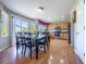 Open kitchen and dining area with stainless steel appliances and views to the outside at 5369 Creek Way, Parker, CO 80134