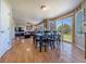 Bright living room with wood floors and large sliding glass door to outdoor patio at 5369 Creek Way, Parker, CO 80134