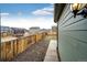 Fenced backyard features a gravel strip and provides privacy for outdoor enjoyment and activities at 316 Maple St, Bennett, CO 80102