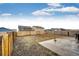 Spacious backyard features a concrete slab, and wood fencing, offering a versatile outdoor space at 316 Maple St, Bennett, CO 80102