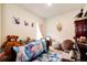 Whimsical bedroom with plush furniture and decor at 316 Maple St, Bennett, CO 80102